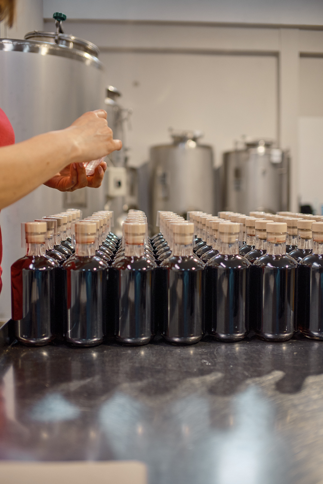 Finished bottles with tanks in background